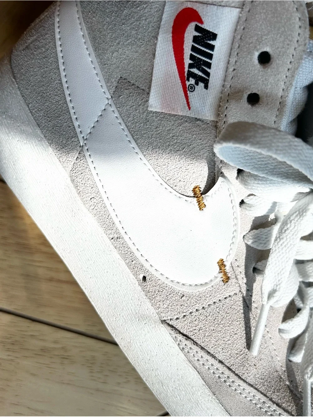 Nike Mid-Top Suede Sneakers in Light Gray with Black Swoosh and Tan Zipper